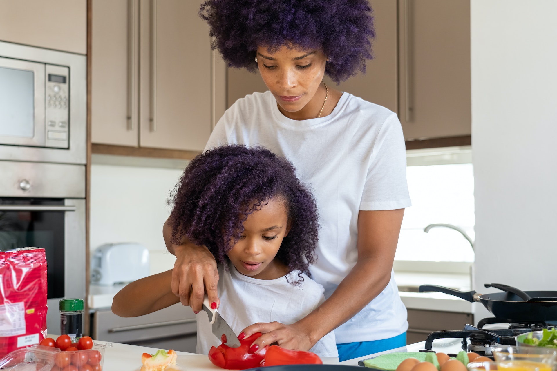 Mother daughter cooking together