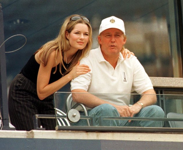 FLUSHING MEADOWS, UNITED STATES: Donald Trump and his girlfriend Celina Midelfar watch Conchita Martinez and Amanda Coetzer 07 September at US Open in Flushing Meadows, NY. AFP PHOTO Timothy CLARY (Photo credit should read TIMOTHY CLARY/AFP/Getty Images)